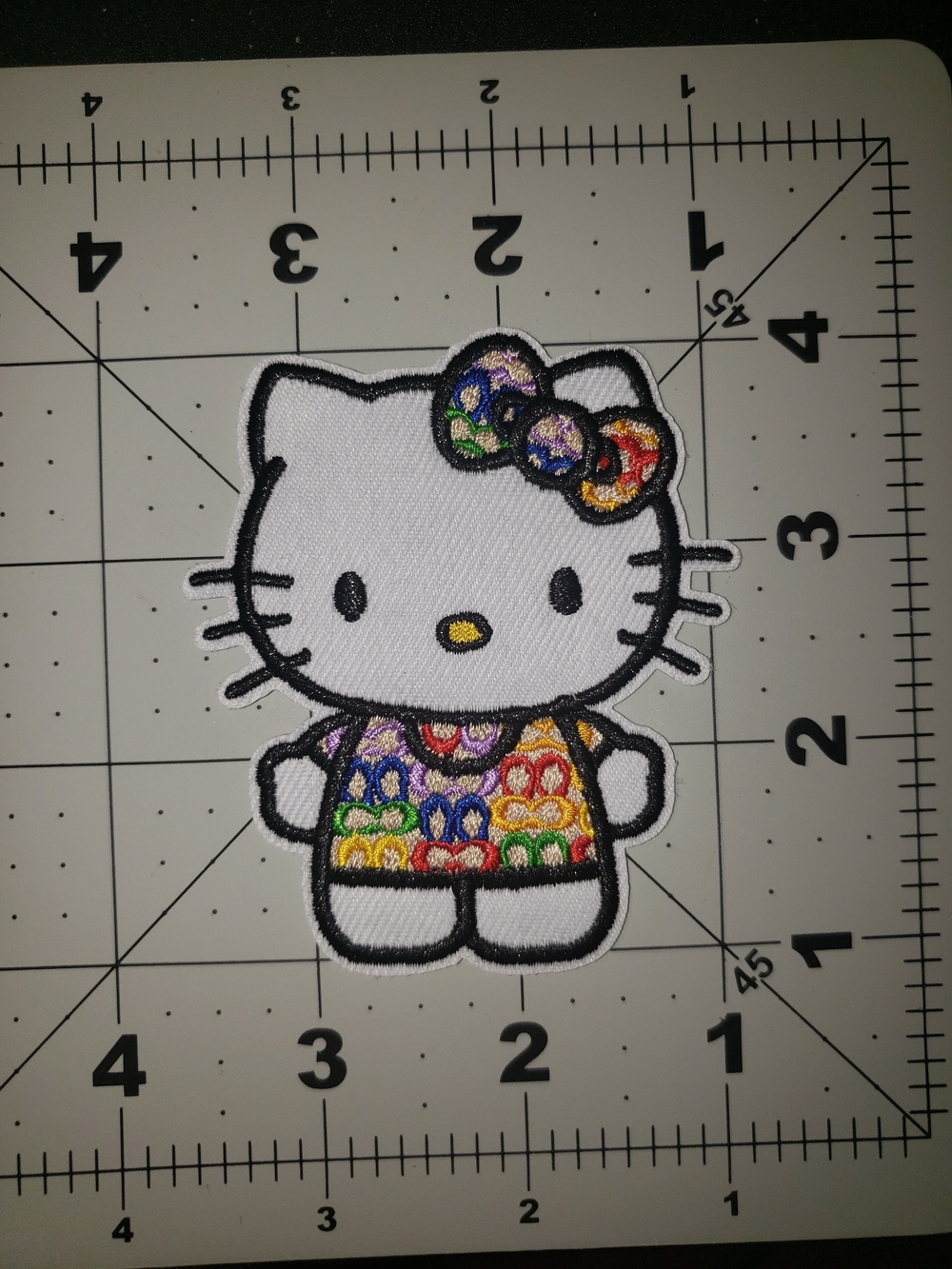 Hello Kitty Rainbow Bow Iron-On Patch - White & Multicolor